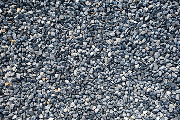 Top view of blue construction gravel texture background. Small granite stone full frame background.