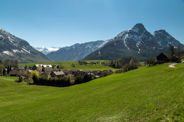 Alpine scenery with green fields and Apls around Bad Aussee, Austria