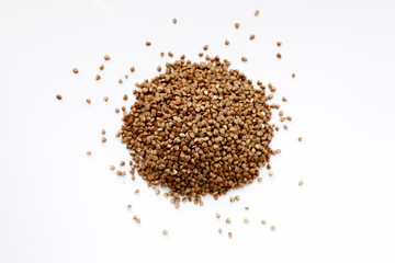 Background, texture-buckwheat on a white background. The concept of healthy, proper nutrition, vegetarianism.
