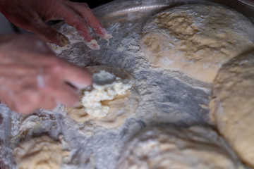 Flour dough sprinkled on a tray