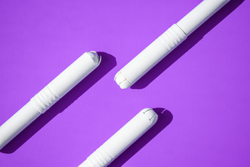 Hygienic tampons on a blue and purple background. copy space, Menstruation sanitary tampon for...