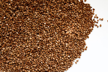 Background, texture-buckwheat on a white background. The concept of healthy, proper nutrition, vegetarianism.