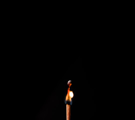 burning matches on a black background