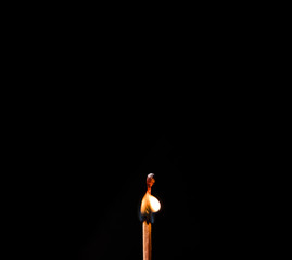 burning matches on a black background