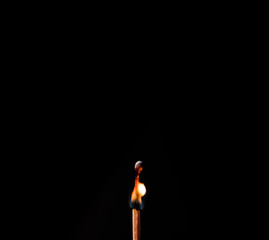 burning matches on a black background