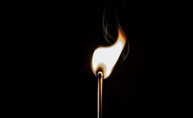 burning matches on a black background