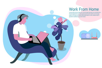 a man is working on a Notebook computer at his home. He is connected to the internet to work and listen to music through Bluetooth devices.