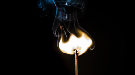 burning matches on a black background
