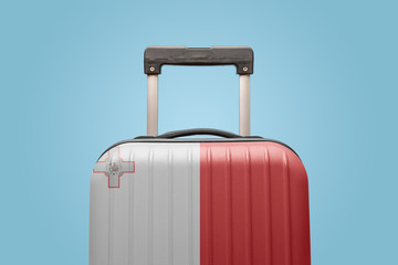 Baggage with Malta flag print tourism and vacation concept.