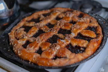 Sweet cake with jam and nuts