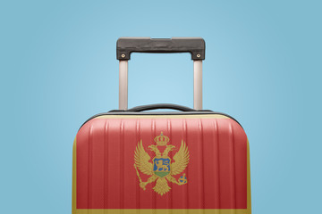 Baggage with Montenegro flag print tourism and vacation concept.