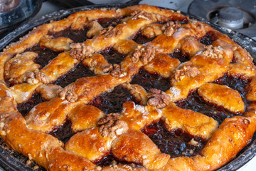 Sweet cake with jam and nuts