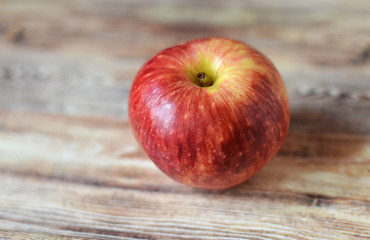 red apples on wooden table