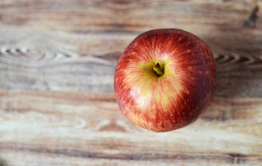 red apples on wooden background