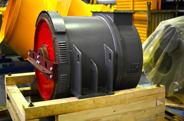 Synchronous traction generator with a cylindrical rotor in the production hall of an automobile...