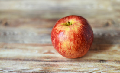 red apples on wooden background
