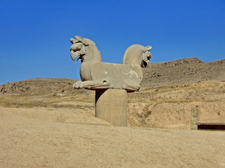 Fototapeta na wymiar 2 headed column's capital with Huma bird. Symbol is very similar to Griffon. Shot in Persepolis, ancient city near Shiraz, Iran