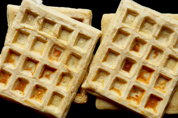 Photography of waffles isolated on black for food background