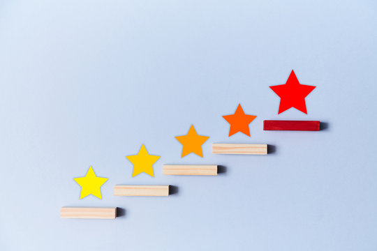 Rate service quality. Mark number of stars on staircase. App for rating. Customer experience concept. Blue background
