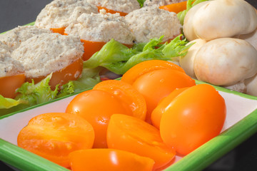 Dish for vegetarians, tomatoes stuffed with chapignons.