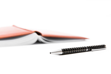 Pen and notebook on a white background, business and education. Isolated