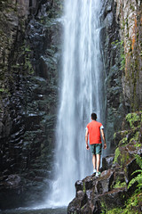 man in the waterfall