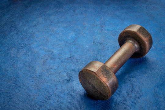 old rusty dumbbell - fitness concept