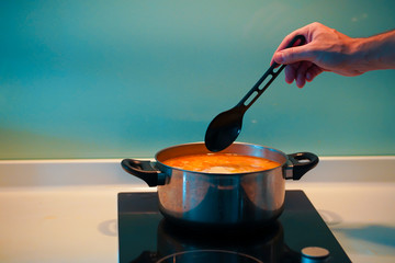 Cooking soup in a pan on an induction stove