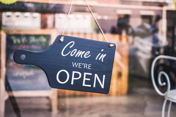 Come in we're open, vintage black retro sign in restaurant