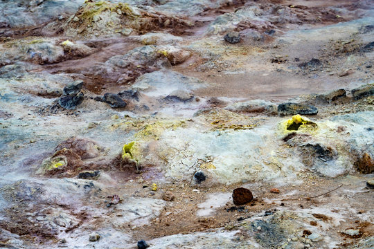 Small volcanic fumaroles surrounded by a delicate rings of sulphur crystals and other colourful salts