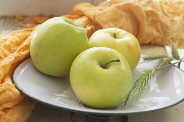 Three apples in a fruit bowl