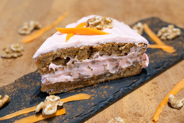 Selective focus of carrot cake cake slice with pink icing
