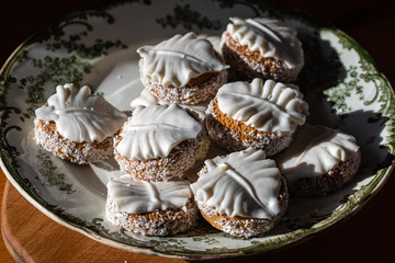 Butter cookies with icing and coconut shavings.