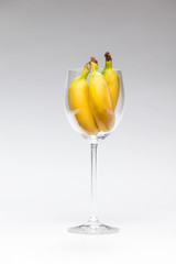 glass with yellow bananas
