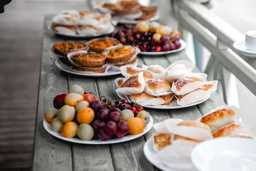 fruit and pies lie on a wooden table