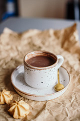 Obraz na płótnie Canvas Beautiful light-colored mug, hand-made mug, drink mug, after-drink mug, mug and saucer, cocoa vanilla, breakfast