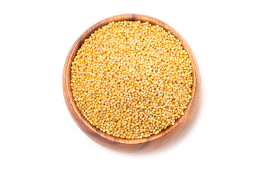 Bowl of Whole Millet in a Wood Bowl Isolated on a White Background