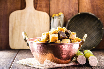typical sugar cane and molasses sweet, made in brazil and latin america, inside a copper pot,...