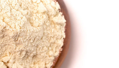 Bowl of Millet Flour in a Wood Bowl Isolated on a White Background