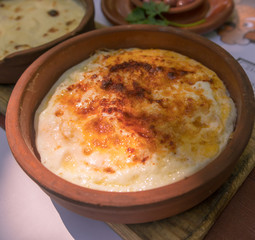 traditional turkish food 'Kuymak' in fried earthenware for breakfast