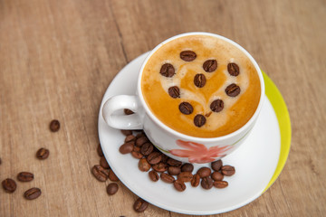 Cup of aromatic natural coffee with thick foam