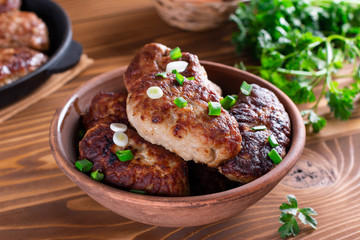 Homemade cutlets in a ceramic bowl