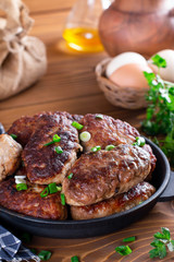 Cutlets served in frying pan