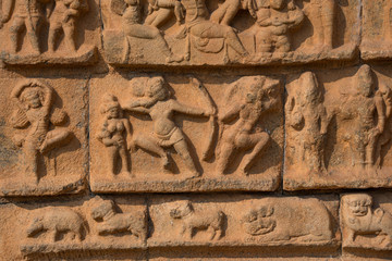 Picture of intricate carvings on the wall of a temple in Tamil Nadu