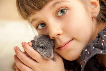 Girl with a little fluffy chinchilla