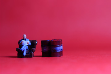 Photo Close Up, Scale HO Sitting old Businessman and Red Oil Barrel, for your element design oil or fuel related