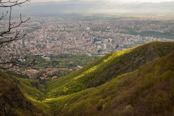 The capital of Bulgaria poured with rays of light in the early mourning. Almost aerial view of the city from the surroundings of Vitosha mountain.