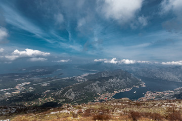 View on bay of Kotor from hill. Amazing blue sky and clouds. A little film grain for atmosphere. 