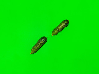 Colorful of fresh pattern cucumber on a green background. Top view