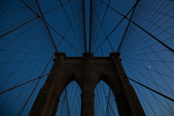 New York City - sunset over Manhattan from Brooklyn Bridge.